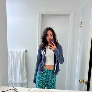 Dark blue stretchy zip-up sweater.